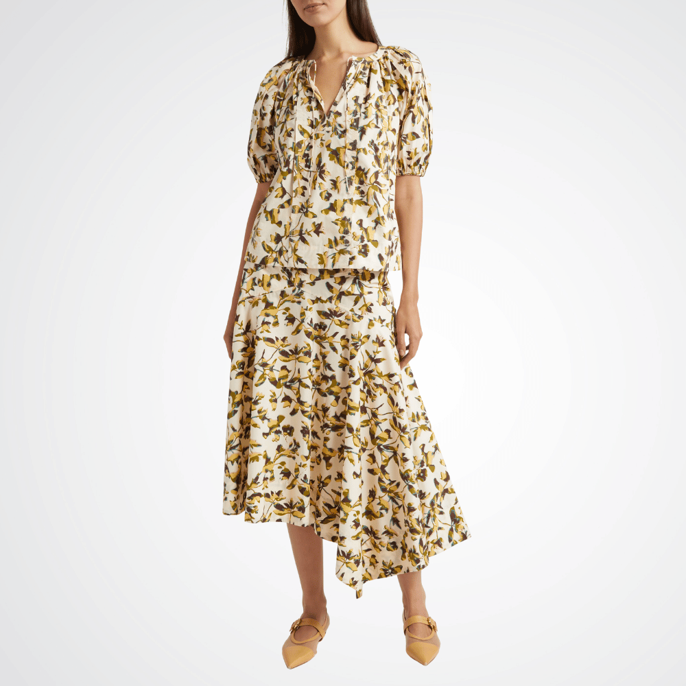 Ulla Johnson Annika High Waist Asymmetrical Midi Skirt in Lucent – luxury cotton poplin graphic bloom midi skirt with asymmetric hem, Available instore and online at Riada Concept, Woollahra Sydney’s destination for a curated selection of international luxury brands