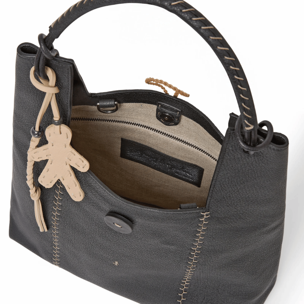 Henry Beguelin Betta Sacca M Martellato Bag in Nero calfskin with top handle, adjustable crossbody strap, and detachable pendant — handmade Italian luxury handbag available at Riada Concept official stockist of luxury labels in Sydney Australia