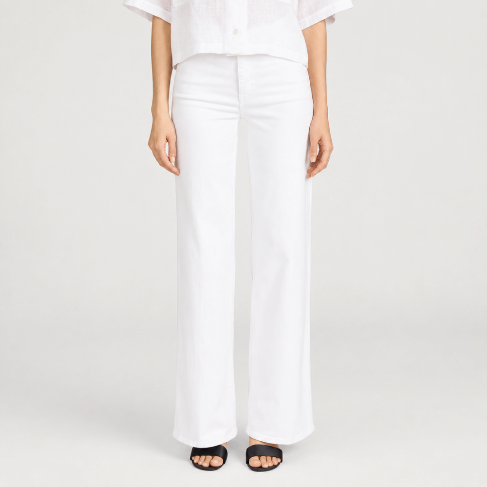 FRAME Le Slim Palazzo Jeans in White at Riada Concept - Front view. High-rise, full-length wide-leg stretch denim. Shop online Australia-wide or in Sydney.
