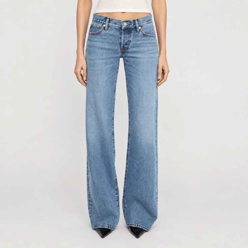 FRAME The Gray Jean in Rapture at Riada Concept. Low-rise rigid denim with a long wide-leg flare, button fly and 34-inch inseam - front view