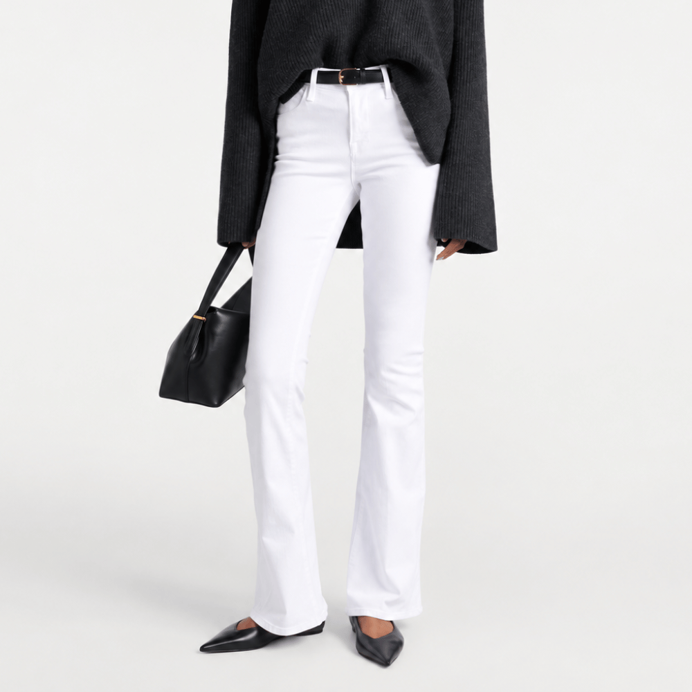 FRAME Le High Flare Jeans in White at Riada Concept. High-rise full-length stretch denim with a sweeping flared leg - front view