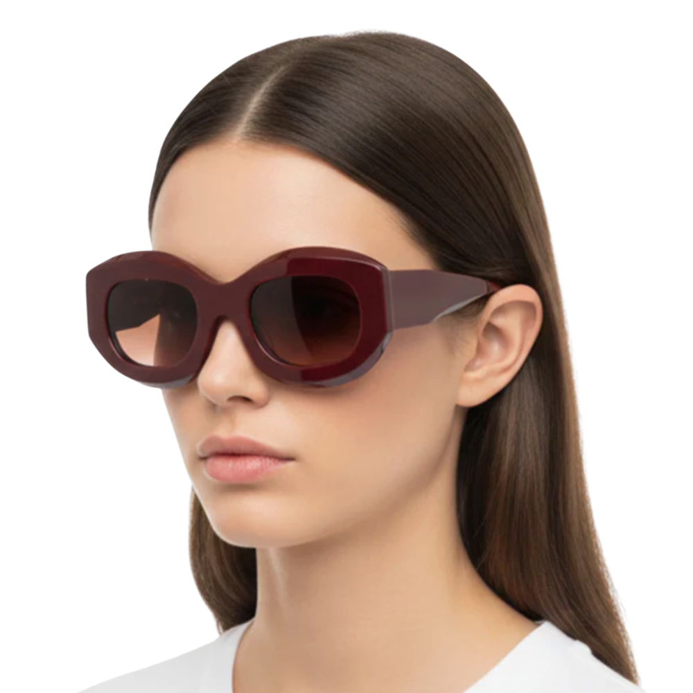 THIERRY LASRY Maroon sunglasses with brown lenses on a white background