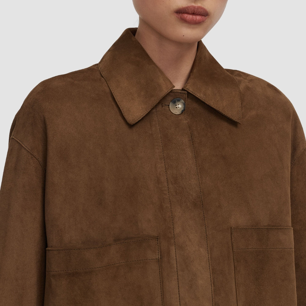 Close-up of the JOSEPH Aitna suede jacket's pointed collar and concealed placket in taupe
