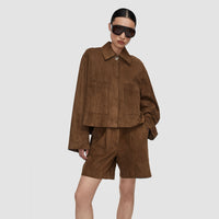 Model wearing the JOSEPH Aitna light suede jacket in taupe, three-quarter view