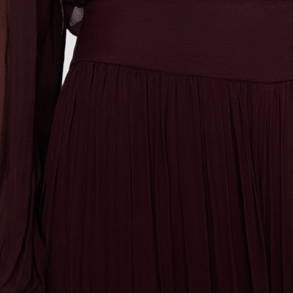 Close-up of the JOSEPH Ale trousers' wide fixed waistband and pleated silk chiffon