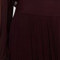 Close-up of the JOSEPH Ale trousers' wide fixed waistband and pleated silk chiffon