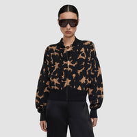 Model wearing the JOSEPH Ambra tortoiseshell knit jacket zipped, front view