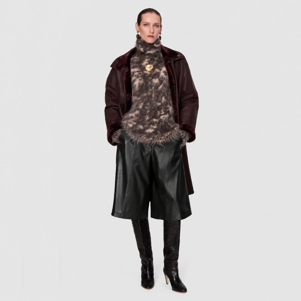 JOSEPH Asia Soft Nappa Leather Long Shorts in Black at Riada Concept. Wide-leg, knee-length lambskin - model full front view