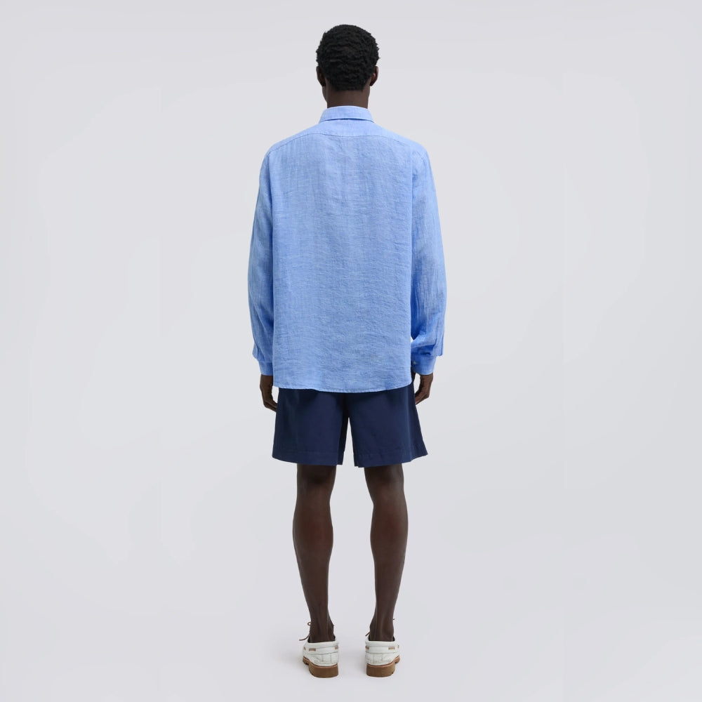 Close-up of the Aspesi Comma shirt's point collar and textured sky blue linen