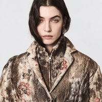 Avant Toi’s gold-laminated wool-cashmere jacket in Yak. Relaxed knit blazer with floral and needle-punched detailing - closeup. Shop at Riada Concept