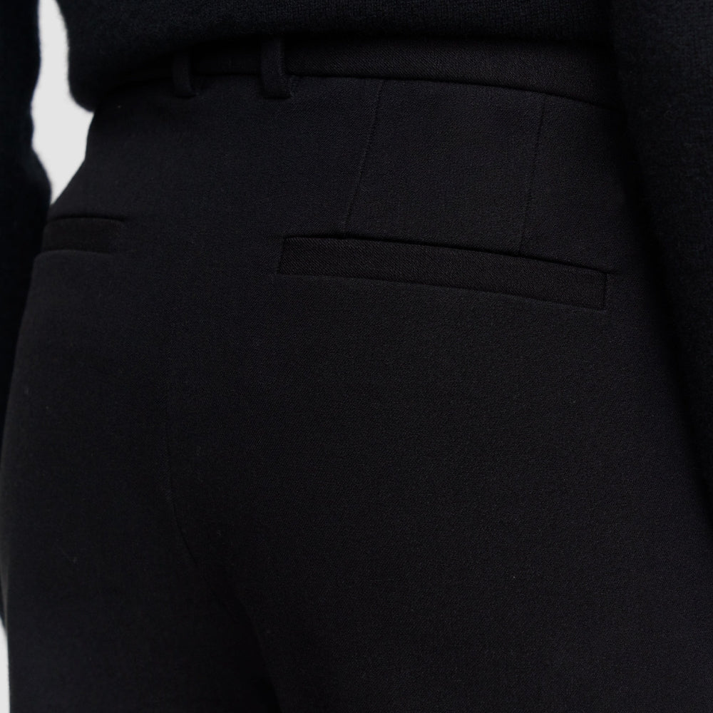 Close-up of the JOSEPH Coleman Long trousers' jetted back pocket and belt loops