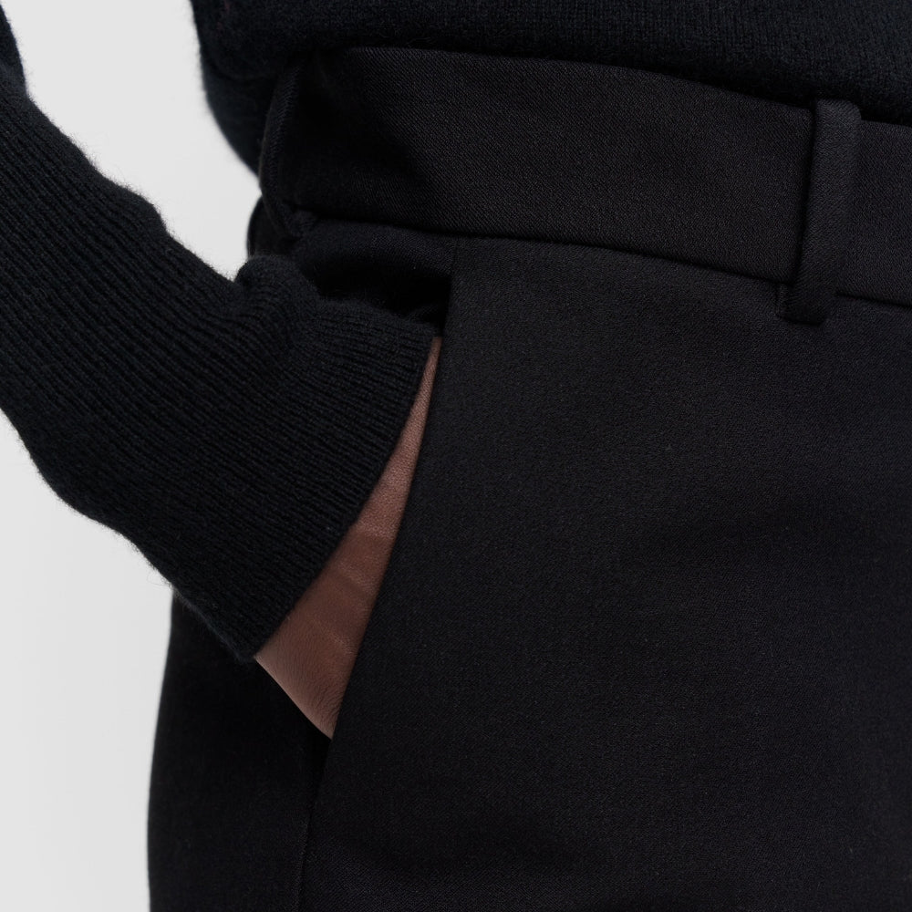 Detail of the JOSEPH Coleman Long black trousers' side pocket and waistband