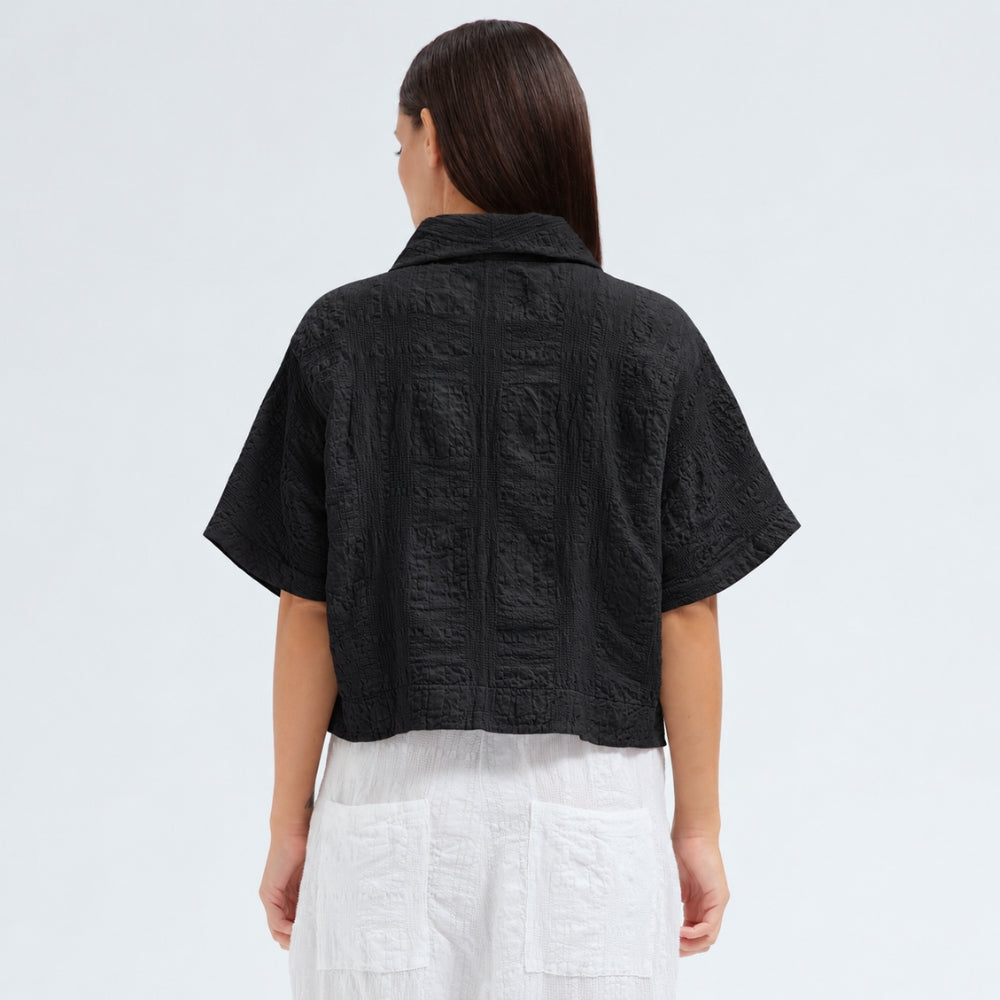 A boxy, cropped kimono jacket by Transit Par Such in black embossed cotton and linen jacquard, with a shawl collar and wide short sleeves - back view