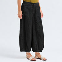 Transit Par Such cropped wide-leg trousers in black linen, with a softly dropped rise, bombé legs pleated at the hem, side pockets and an elastic back waist - angle view