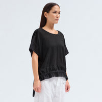 An oversized black T-shirt by Transit Par Such in crepe cotton jersey, with dropped shoulders and a cotton muslin hem band with a drawstring - angle view
