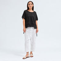 An oversized black T-shirt by Transit Par Such in crepe cotton jersey, with dropped shoulders and a cotton muslin hem band with a drawstring - full front view