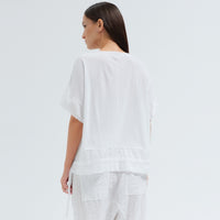 An oversized white T-shirt by Transit Par Such in crepe cotton jersey, with dropped shoulders and a cotton muslin hem band with a drawstring - back view