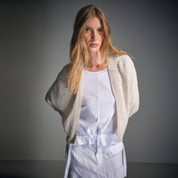 An oversized white T-shirt by Transit Par Such in crepe cotton jersey, with dropped shoulders and a cotton muslin hem band with a drawstring - campaign model view