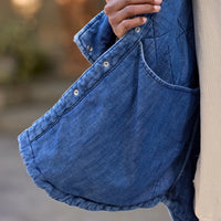 Frank & Eileen Eileen Quilted Shirt Jacket in distressed indigo diamond-quilted denim - close-up hem detail