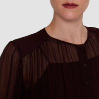 Close-up of the JOSEPH Elisa blouse's pleated silk chiffon, yoke and tonal buttons