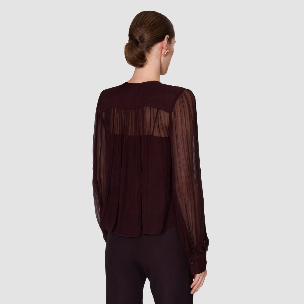 Back view of the JOSEPH Elisa silk chiffon blouse in mahogany, showing the yoke and sheer sleeves