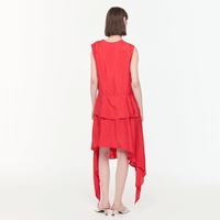 Plan C Asymmetric Viscose Skirt in Fire Red styled on model with draped asymmetric hem - back view