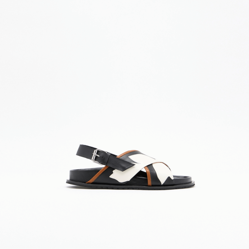 Plan C black leather Fussbett sandal side view with white flower intarsia and buckle strap