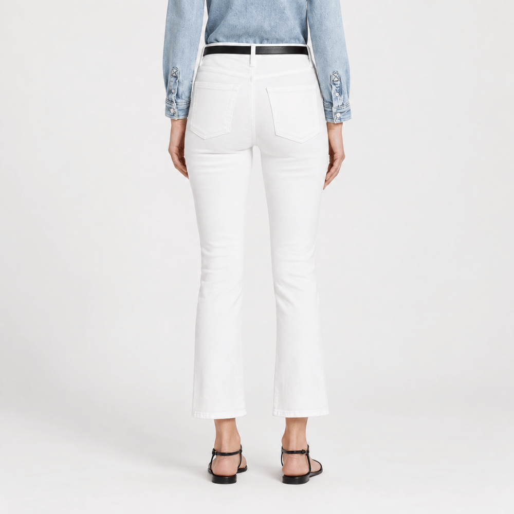 FRAME Le Crop Mini Boot jeans in Blanc at Riada Concept. High-rise white cropped bootcut jeans in soft comfort-stretch denim - back view