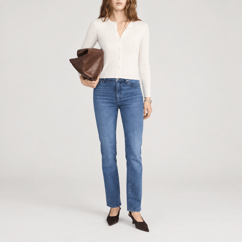 FRAME Le Sleek Straight Jeans in Ease at Riada Concept. High-rise ankle-length straight jeans in super-stretch mid-blue denim - styled model view