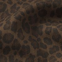 FRAME Le Slim Palazzo Jeans in Leopard at Riada Concept. High-rise wide-leg super-stretch denim in a rich brown animal print - fabric close up