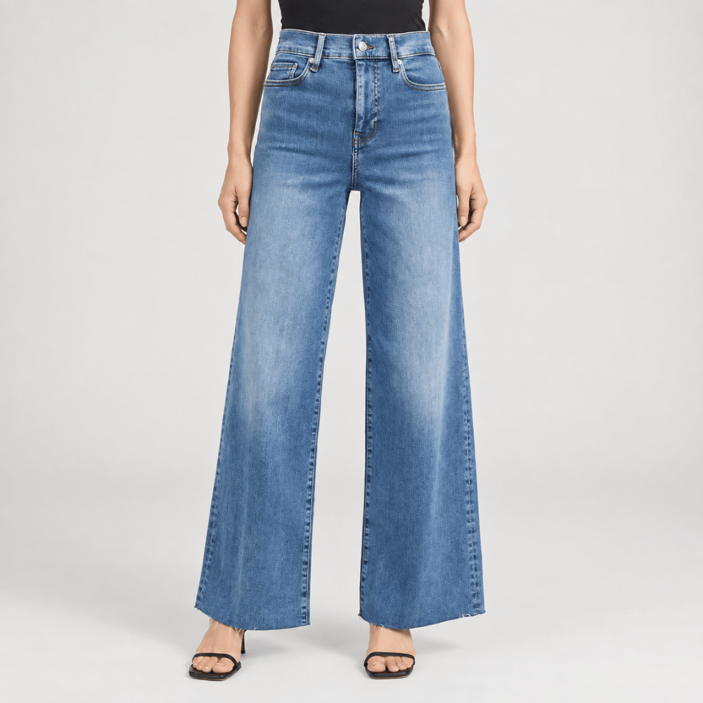 FRAME Le Slim Palazzo Raw Fray Jeans in Mermaid at Riada Concept. High-rise medium-blue wide-leg stretch denim with raw hem - front view