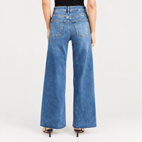FRAME Le Slim Palazzo Raw Fray Jeans in Mermaid at Riada Concept. High-rise medium-blue wide-leg stretch denim with raw hem - back view