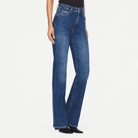 FRAME The Arrow jeans in Rival at Riada Concept. High-rise blue bootcut jeans in comfort-stretch denim with a 33-inch inseam - angle view