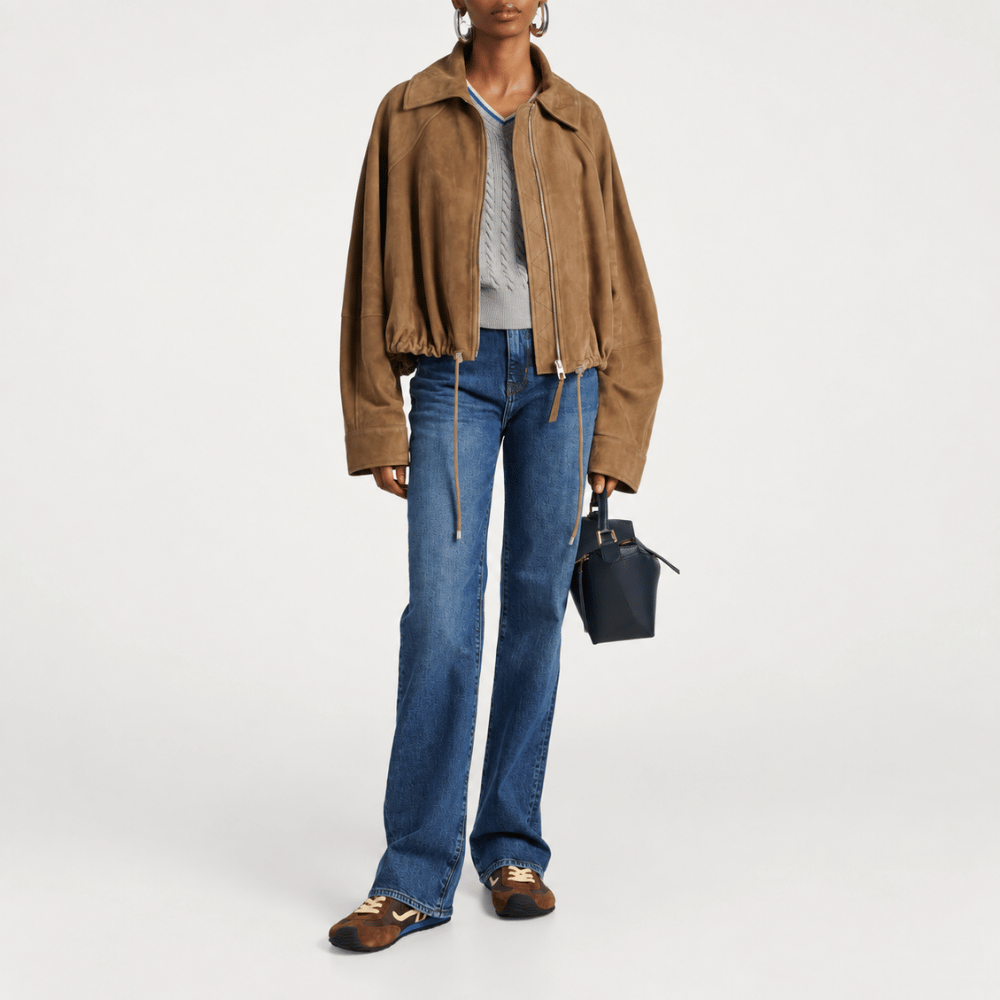 FRAME The Arrow jeans in Rival at Riada Concept. High-rise blue bootcut jeans in comfort-stretch denim with a 33-inch inseam - full front view of styled model