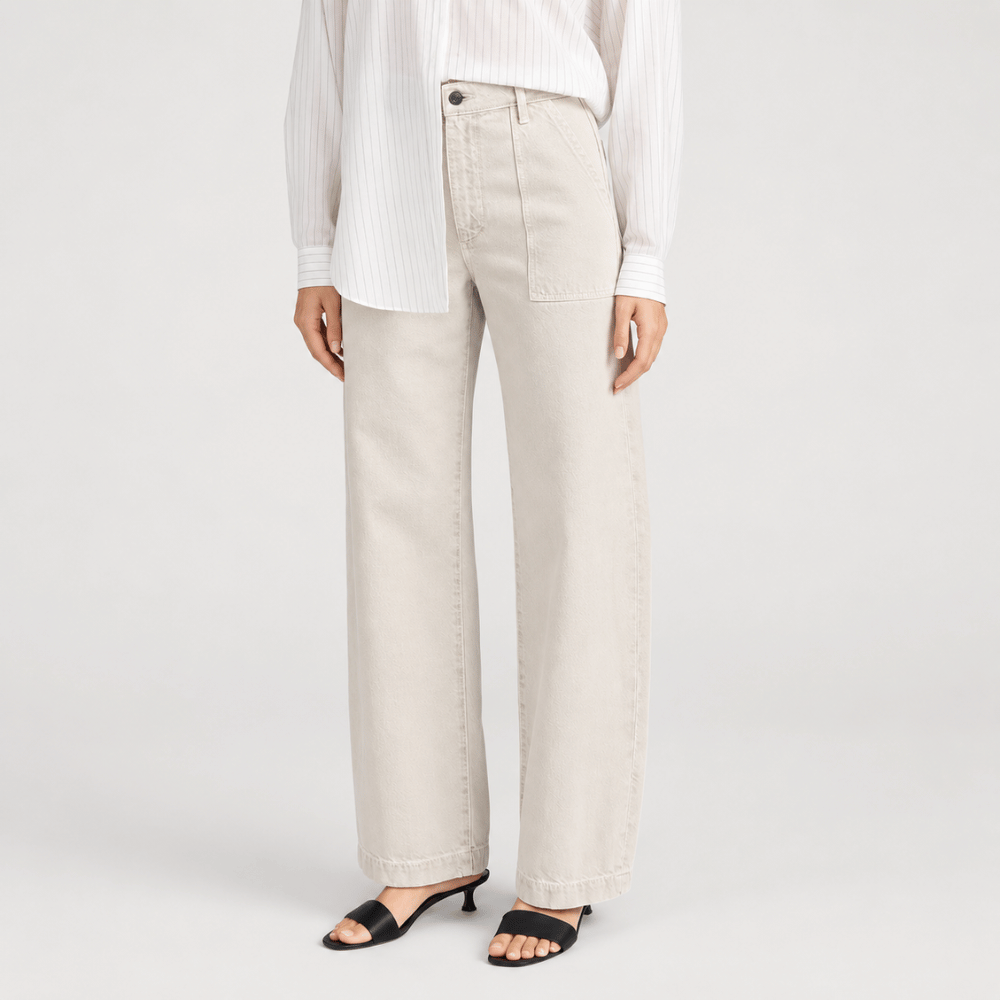 FRAME The Bow Cargo Jeans in Flax at Riada Concept. High-rise rigid denim with flat utility pockets and a sculpted barrel leg - angle view