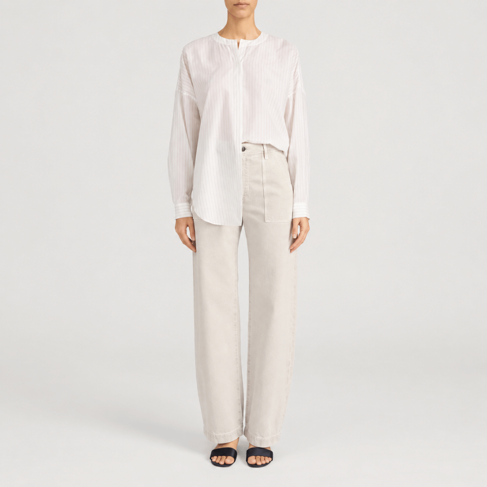 FRAME The Bow Cargo Jeans in Flax at Riada Concept. High-rise rigid denim with flat utility pockets and a sculpted barrel leg - front styled model view