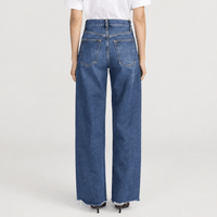 FRAME The Bow Jeans in Acumen New Fray at Riada Concept. High-rise rigid denim with a sculpted barrel leg and raw frayed hem - back view