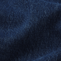 FRAME The Bow Jeans in Acumen New Fray at Riada Concept. High-rise rigid denim with a sculpted barrel leg and raw frayed hem - close-up fabric texture