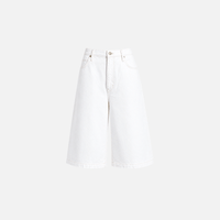 FRAME The Boy Shorts in Au Natural Clean at Riada Concept. Mid-rise long white denim shorts in rigid regenerative cotton for summer. 