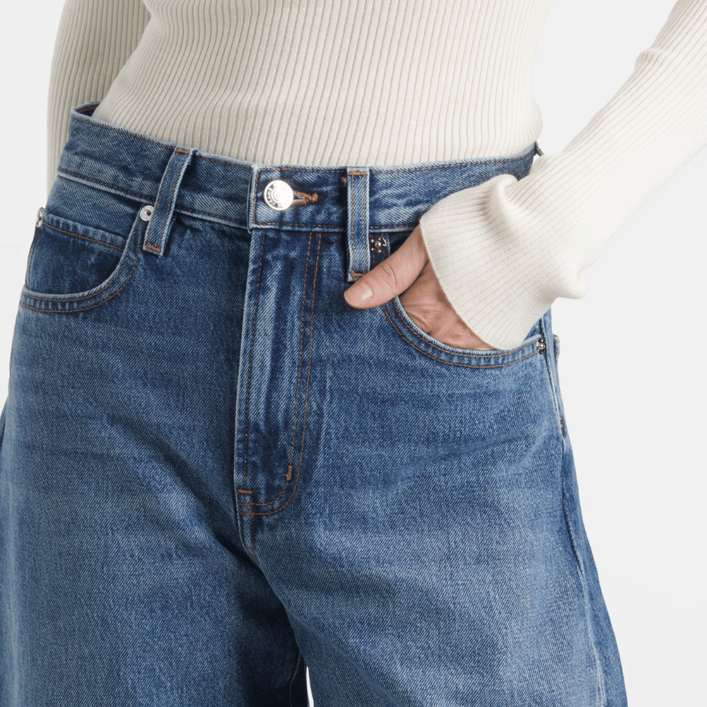 FRAME The Bubble Jeans in Westbury at Riada Concept. High-rise rigid barrel jeans with a curved leg and adjustable rolled cuff - close-up waistband, front pockets, button detail