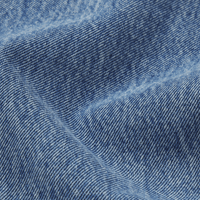A close-up the FRAME The Essential Jean in Rapture at Riada Concept. Mid-rise full-length straight jeans in rigid regenerative cotton denim -  blue denim fabric with visible twill texture and soft folds