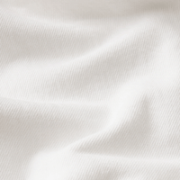 A close-up of white ribbed denim fabric with soft folds and a smooth texture - FRAME The Essential Jean in White at Riada Concept. Mid-rise full-length straight jeans in rigid regenerative cotton denim