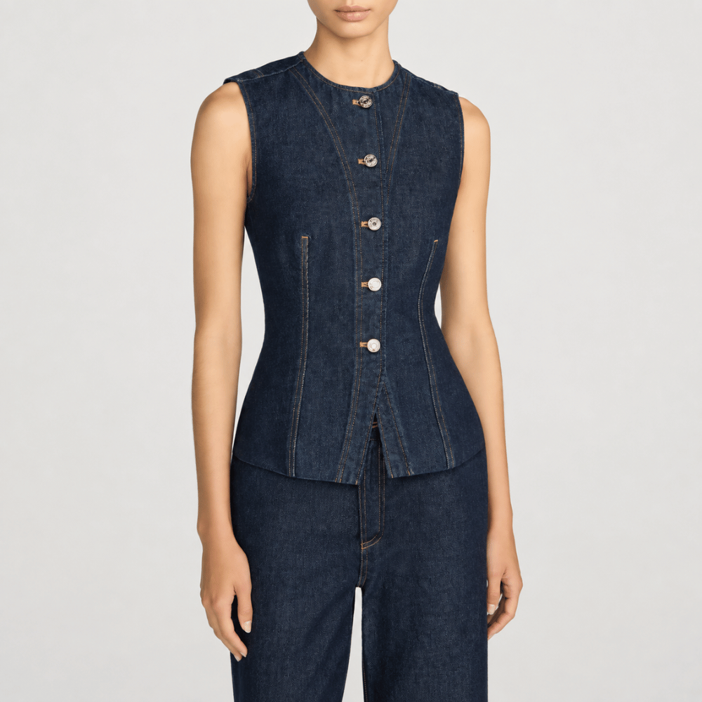 FRAME The Form Vest in Rinse at Riada Concept. Sculpted rigid indigo denim waistcoat with princess seams and silver buttons - front view