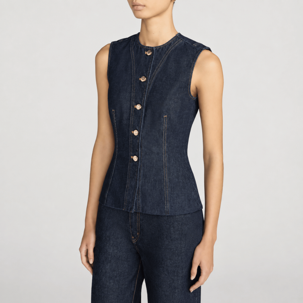 FRAME The Form Vest in Rinse at Riada Concept. Sculpted rigid indigo denim waistcoat with princess seams and silver buttons - side view
