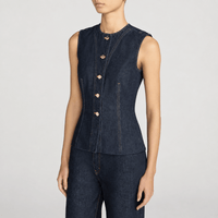 FRAME The Form Vest in Rinse at Riada Concept. Sculpted rigid indigo denim waistcoat with princess seams and silver buttons - side view