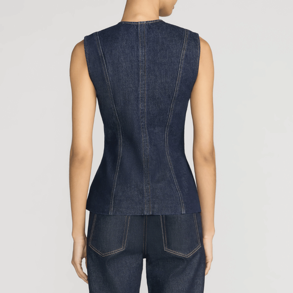 FRAME The Form Vest in Rinse at Riada Concept. Sculpted rigid indigo denim waistcoat with princess seams and silver buttons - back view