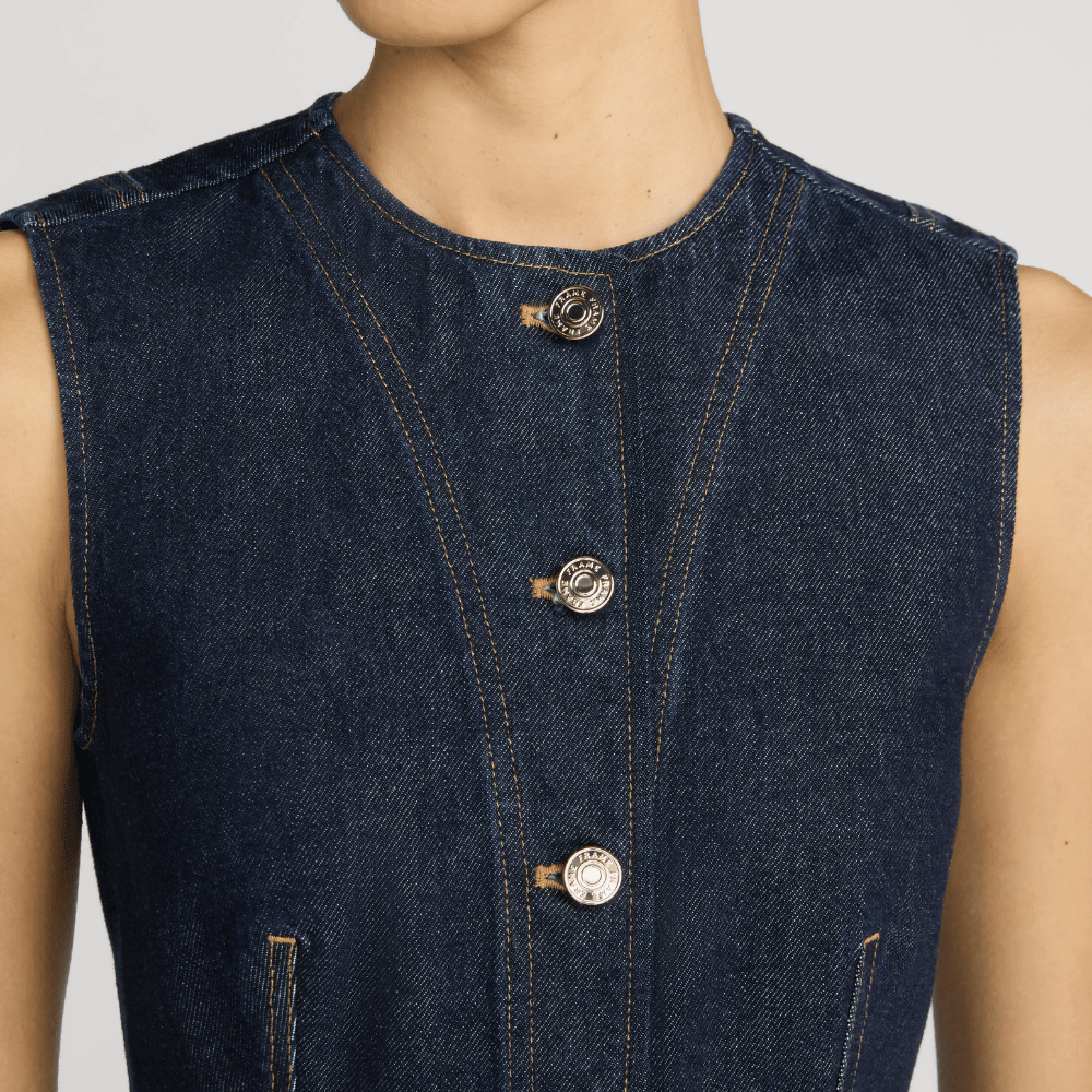 FRAME The Form Vest in Rinse at Riada Concept. Sculpted rigid indigo denim waistcoat with princess seams and silver buttons - close-up button view