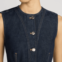 FRAME The Form Vest in Rinse at Riada Concept. Sculpted rigid indigo denim waistcoat with princess seams and silver buttons - close-up button view