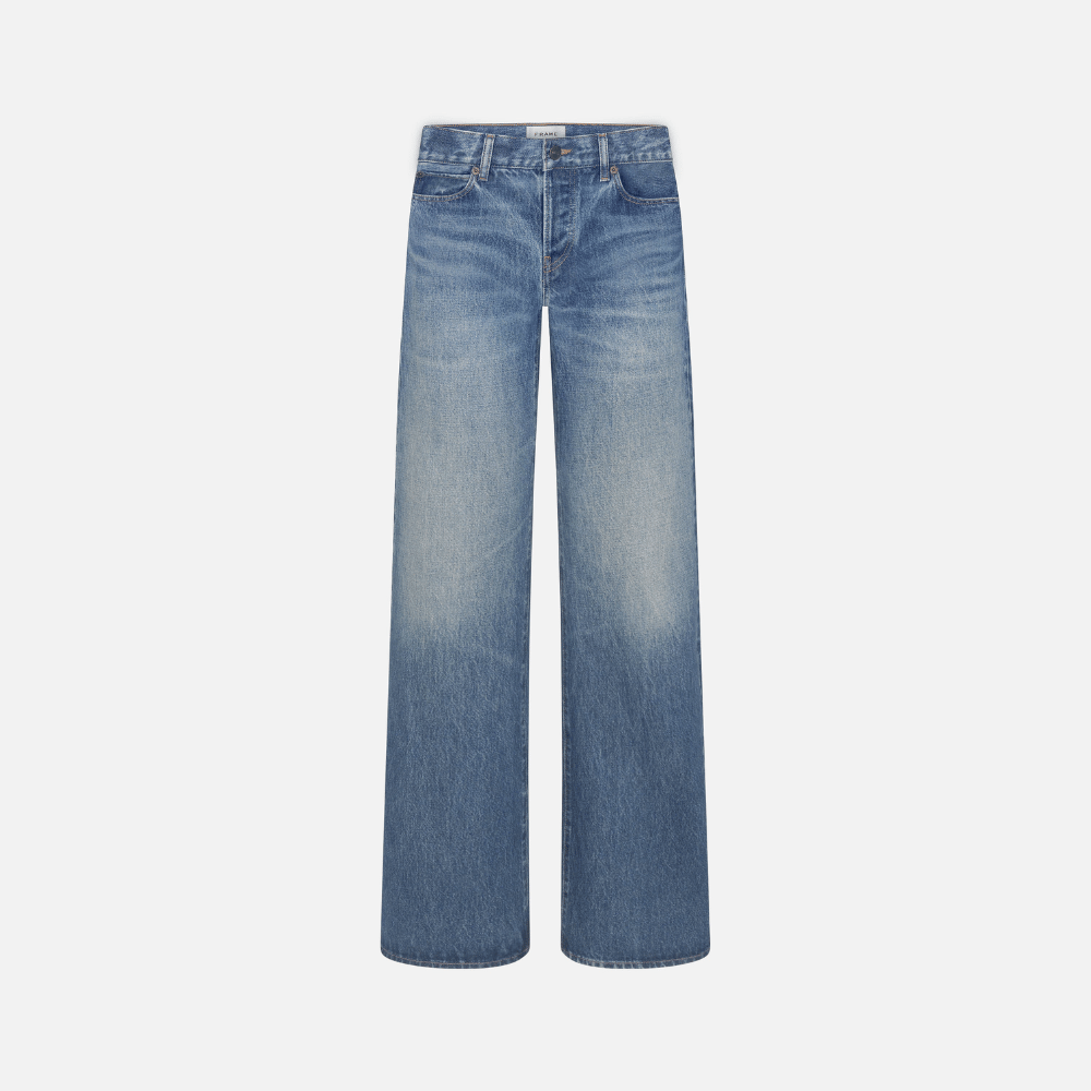 FRAME The Gray Jean in Rapture at Riada Concept. Low-rise rigid denim with a long wide-leg flare, button fly and 34-inch inseam.