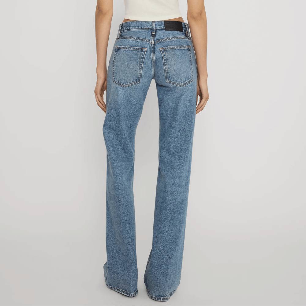 FRAME The Gray Jean in Rapture at Riada Concept. Low-rise rigid denim with a long wide-leg flare, button fly and 34-inch inseam - back view